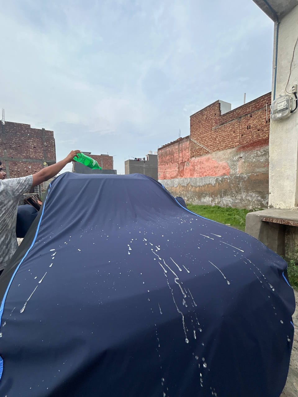 Navy car cover, water poured on the roof